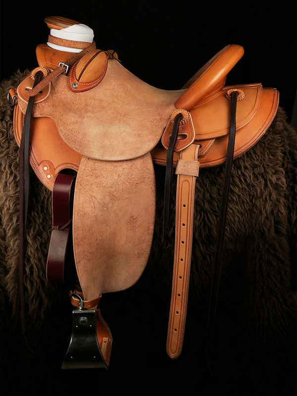 The Colt Starter, Wade Tree, 15 inch seat, Gullet - 7 and 1/2 inch by 6 and 1/4 inch by 4 inch, Horn 4 and 1/4 by 4 inch Guatelajara, 90 degree bars, 7/8ths flat palte riggin, Cheyenne Roll, built by Keith Valley.